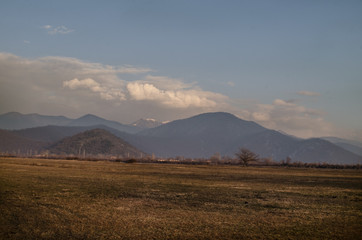 Snow covered mountain landscape, Cloudy landscape of mounatins and fields at winter time. Caucasus, Azerbaijan, Gakh Sheki Zagatala