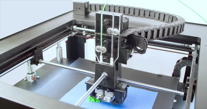 Working 3D printer 4k video. Process of printing three dimensional model. Additive manufacturing device machine technology concept