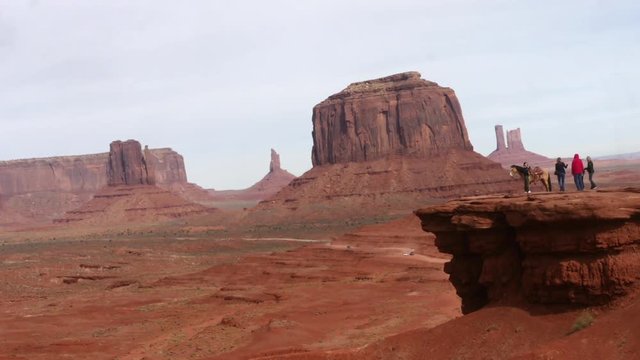 MONUMENT VALLEY, UTAH, UNITED STATES OF AMERICA, OKTOBER 28  Timelapse of People at John Wayne point, in mountain valley, on the border of Arizona and Utah, In United states of America