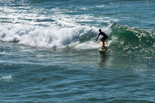 Sydney, NSW, Australia - DEC 01, 2015, Young surfer surfing at Bondi beach.