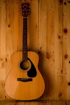 acoustic guitar on wood. background,still life