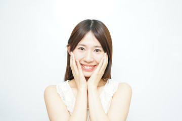 Young woman skin caring in the room