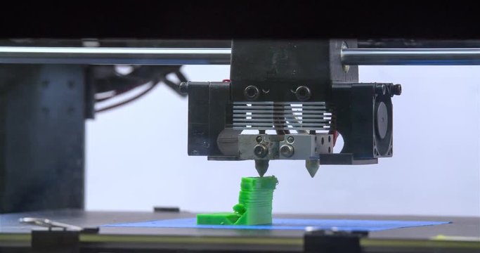 Working 3D printer 4k close-up video. Process of printing three dimensional model. Extruder creates object. Additive manufacturing device machine technology concept