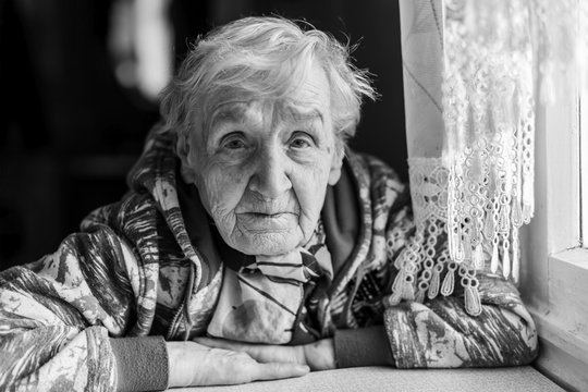Portrait of an elderly woman. Black and white photo.