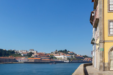 Fototapeta na wymiar Douro river and a tourist boat in Porto, Portugal