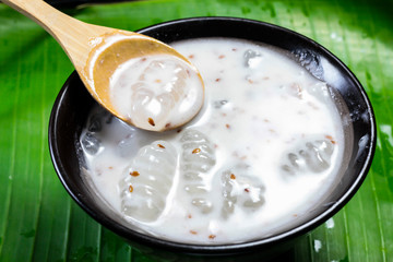 Caramelized crisps in coconut sauce. Thai dessert.