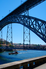 Ponte Luis I Bridge over the Douro river and a traditional boat