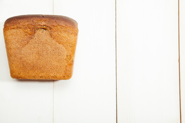 Bread on a white wooden background