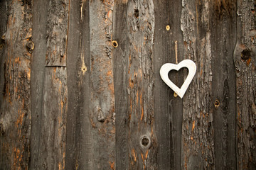 White heart on rustic wooden background