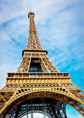 Eiffle tower from the bottom in the day time cloudy