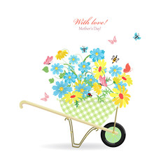 cute garden wheelbarrow with wild flowers with love. mother's da