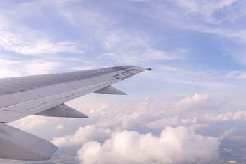 Fototapeta na wymiar Blue sky and Clouds as seen through window of aircraft