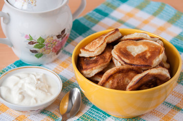 Delicious pancakes with sour cream for breakfast