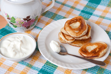 Delicious pancakes with sour cream for breakfast