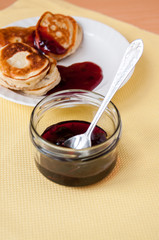 Delicious pancakes for breakfast with cherry jam