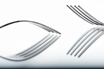 Concept with fork on white background IX / The abstract concept of a simple subject