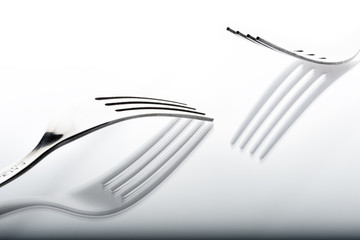 Concept with fork on white background VIII / The abstract concept of a simple subject