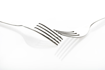Concept with fork on white background IV / The abstract concept of a simple subject