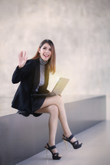 Asian people business woman sit down on the balcony, The beautiful business women finger pointing and smiling , brown wall background - 135887322