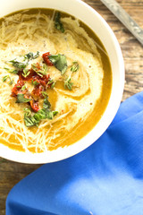 soup with tomatoes and greens closeup
