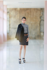 Obraz premium Asian people young businesswoman standing, The beautiful model business women hold suit and smiling