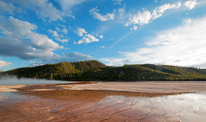 Grand Prismatic Hot Spring under sunset clouds in the Midway Geyser Basin in Yellowstone National Park in Wyoming USA