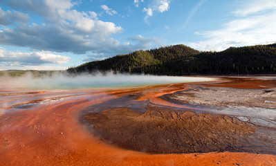 Grand Prismatic Hot Spring under sunset clouds in the Midway Geyser Basin in Yellowstone National Park in United States