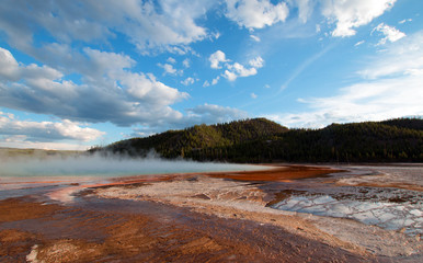 Grand Prismatic Hot Spring under sunset clouds in the Midway Geyser Basin in Yellowstone National Park in USA