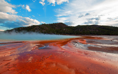 Grand Prismatic Hot Spring under sunset clouds in the Midway Geyser Basin in Yellowstone National Park in Wyoming USA