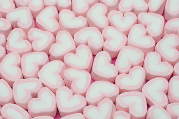 Pink heart shaped marshmallows background
