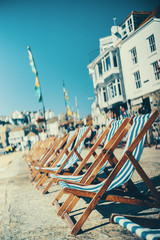 Empty deck chairs along the St Ives beach in the harbour front. - 135889761