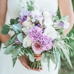 Beauty wedding bouquet in bride's hands