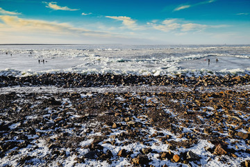 winter fishing on the sea the bright sun