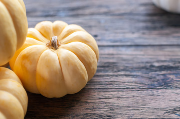 Pumpkin on wooden background with copy space
