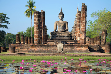 View of a sculpture of the sitting Buddha on ruins of the temple Wat Chana Songkram. Sukhothai...