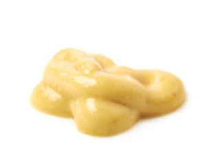 Splash of a mustard souce isolated