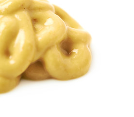 Splash of a mustard souce isolated