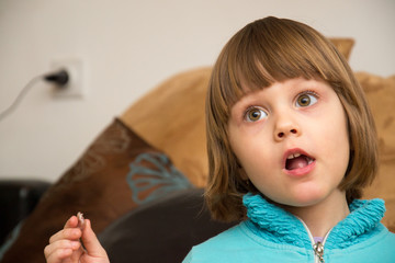 Young girl looking with a shock expression 
