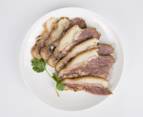 Delicious Chinese food, pig`s cheek meat,  pieces of meat cut from a pig`s head served as a cold dish to go with drinks, some marinated food in China.