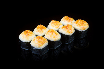 Japanese rolls on black background