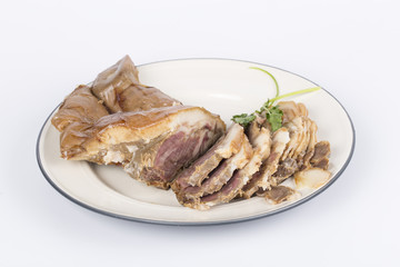 Delicious Chinese food, pig`s cheek meat,  pieces of meat cut from a pig`s head served as a cold dish to go with drinks, some marinated food in China.