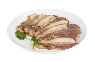 Delicious Chinese food, pig`s cheek meat,  pieces of meat cut from a pig`s head served as a cold dish to go with drinks, some marinated food in China.