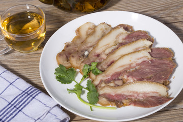 Delicious Chinese food, pig`s cheek meat,  pieces of meat cut from a pig`s head served as a cold dish to go with drinks, some marinated food in China.