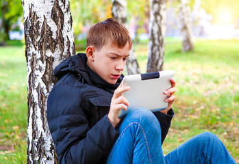 Sad Teenager with Tablet