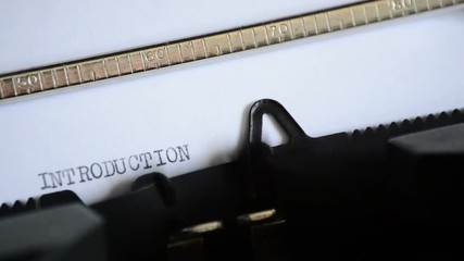 Typing the word INTRODUCTION with in a old manual typewriter