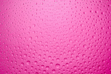 Water drops pink background. Water drops on glass background