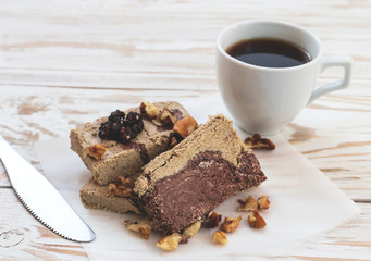 Marble sesame halva with cocoa and cup of coffee