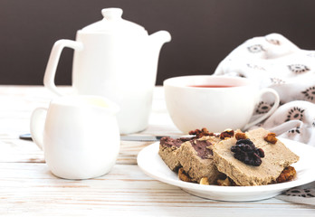 Marble sesame halva with cocoa and cup of tea