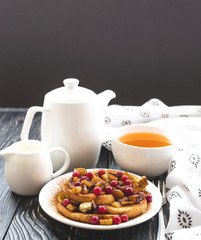 Hot french toasts with caramelized apples, and tea