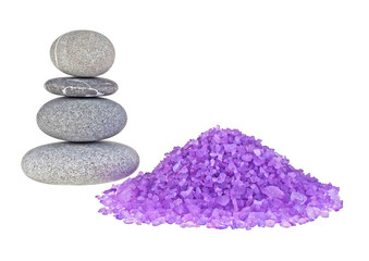 Obraz na płótnie Canvas Violet sea salt and spa stones isolated on white background
